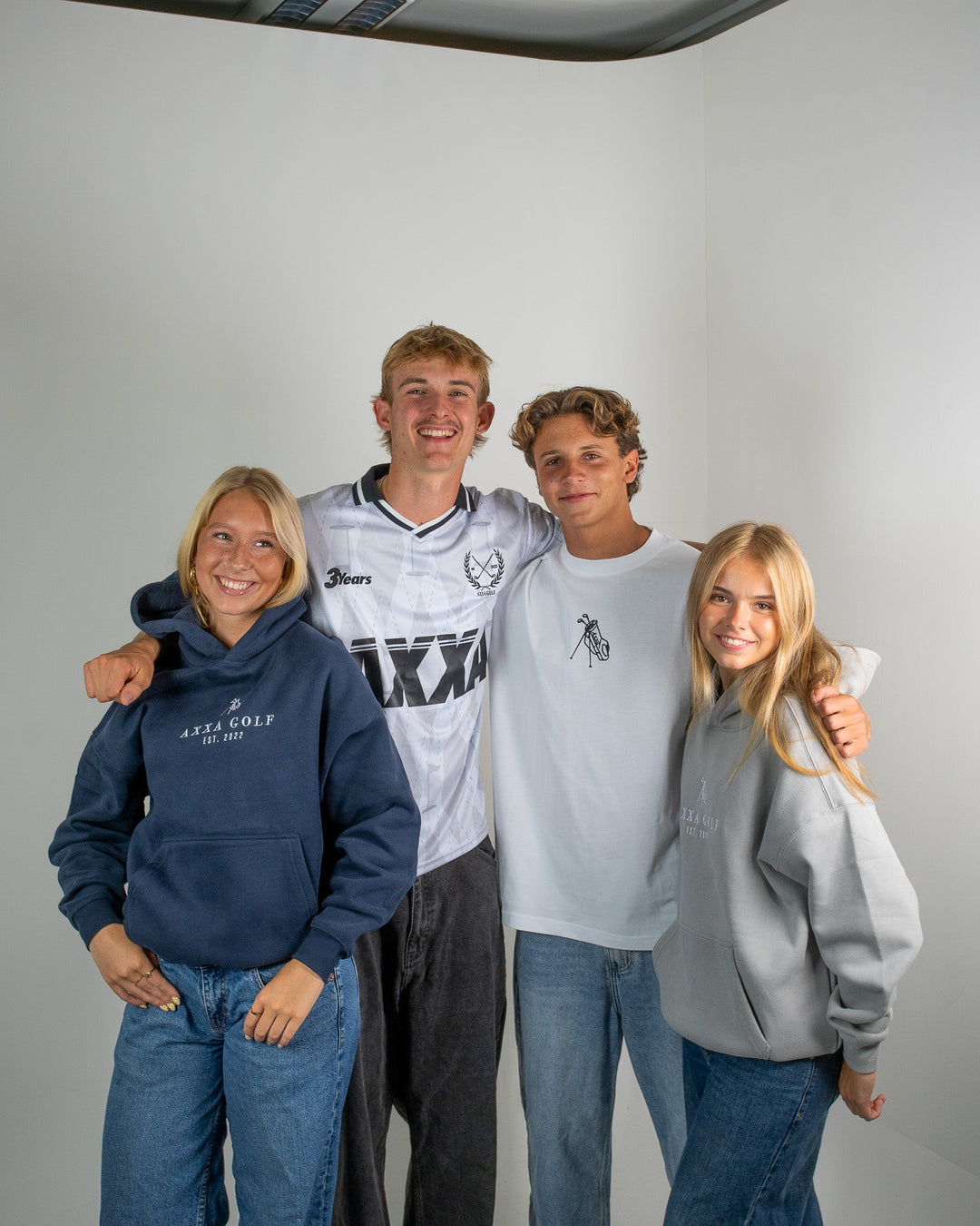 Axel Karlsson-Lacy (Left Middle) celebrating Axxa's three year anniversary during a photoshoot